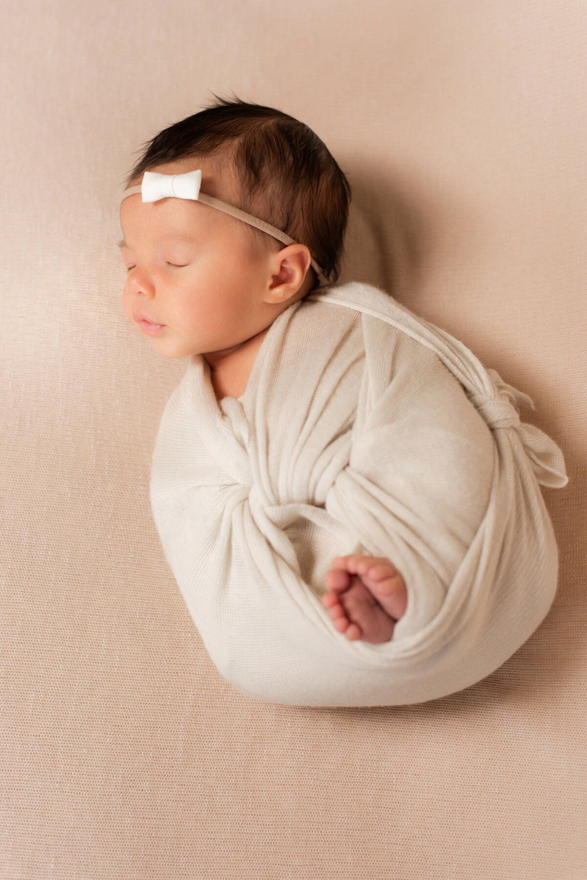 newborn swaddled for a picture with a neutral color palette in amarillo