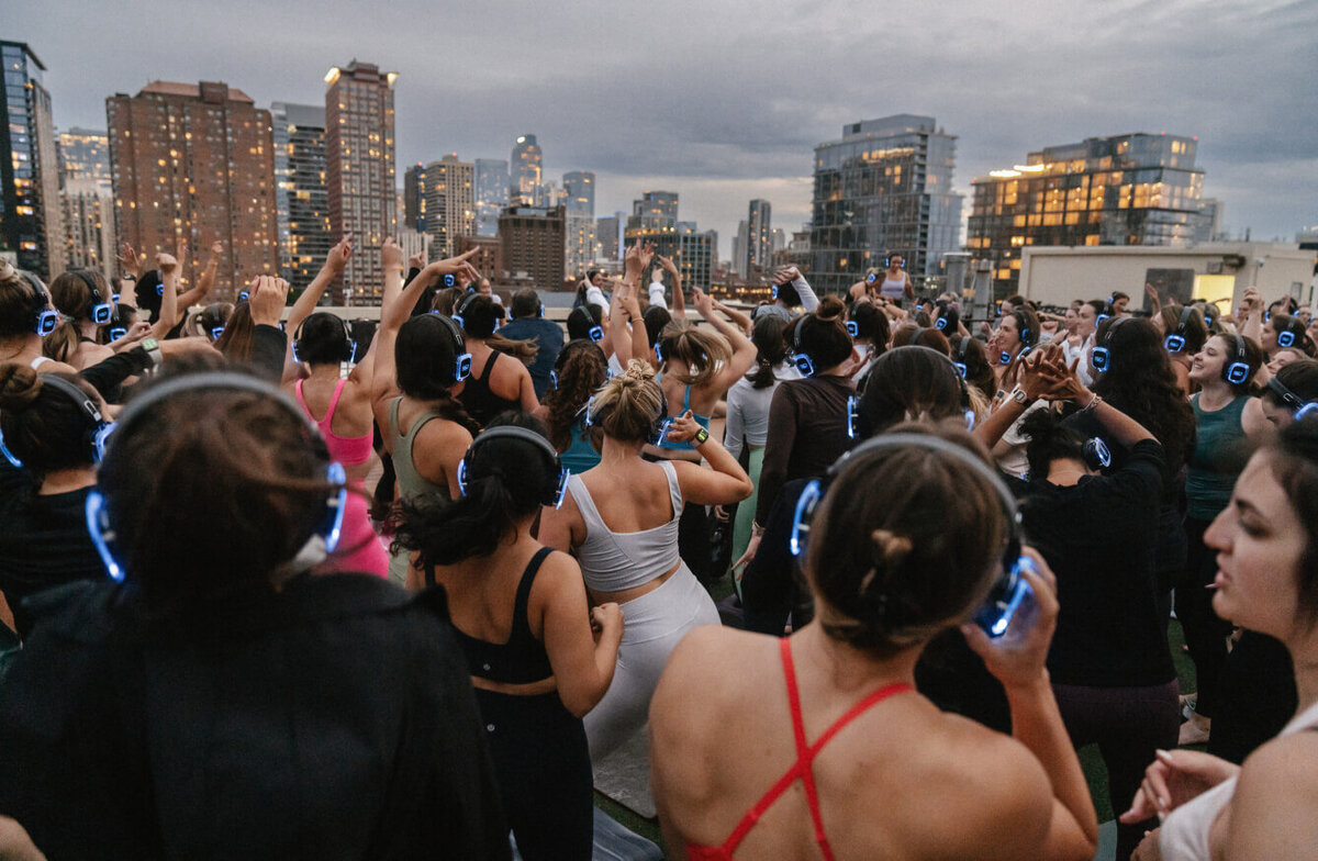 women dancing during a silent disco rooftop session