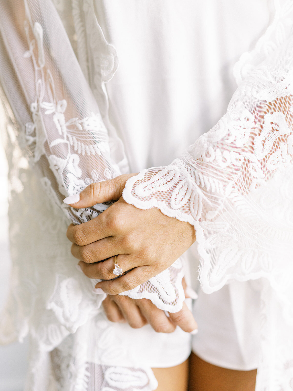 destination-wedding-bride-robe-lace-hands