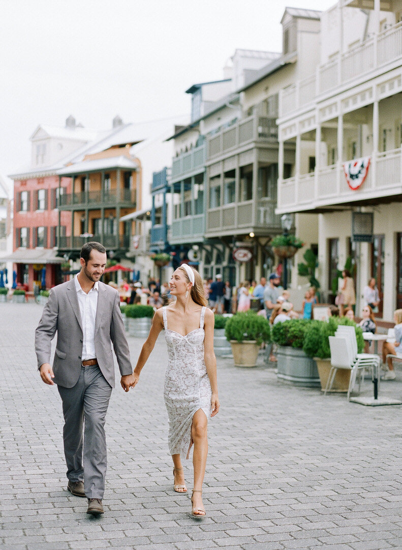 Couple Holding Hands Walking Down Street at Rosemary Beach Photo