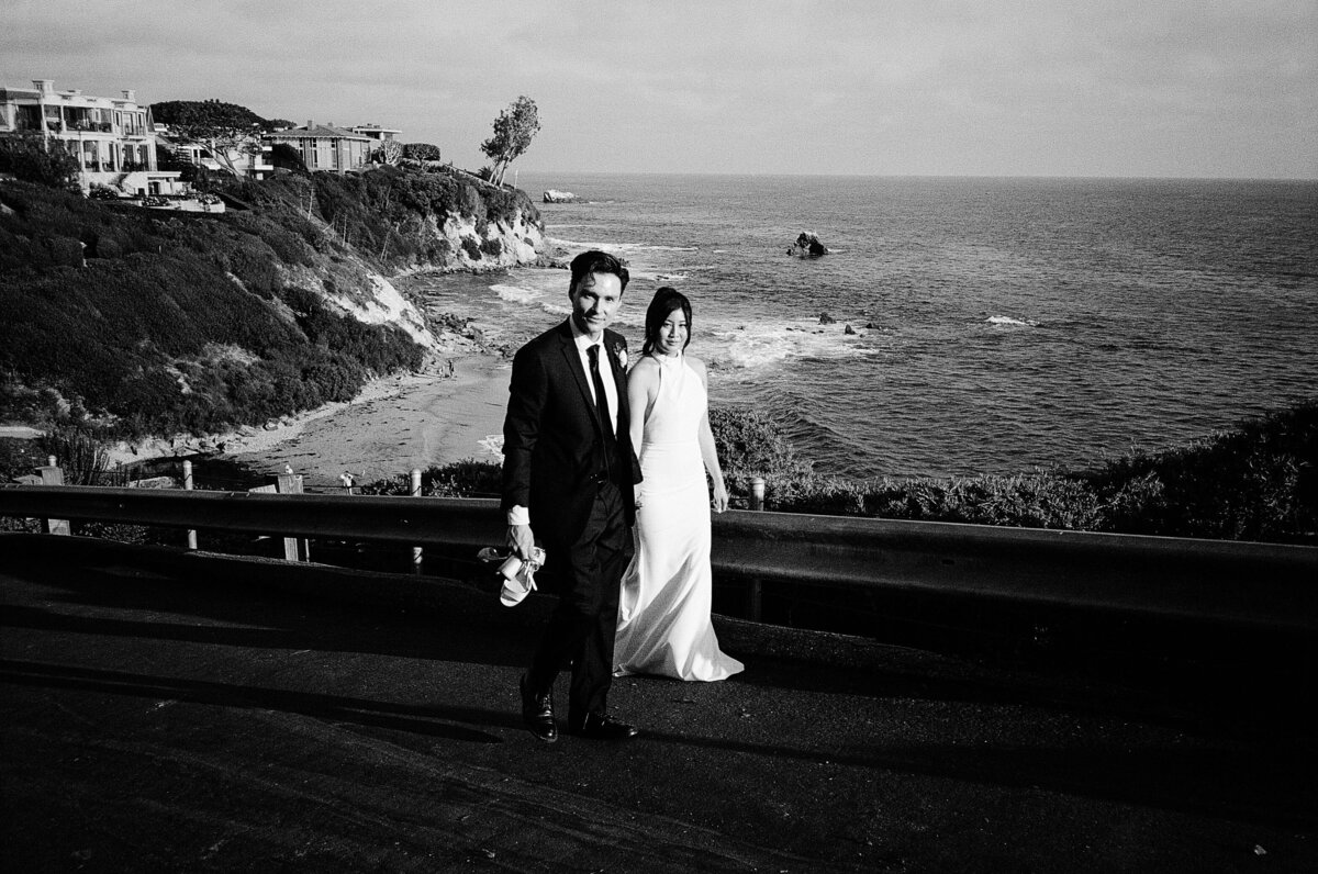 bride and groom portraits overlooking the ocean in California