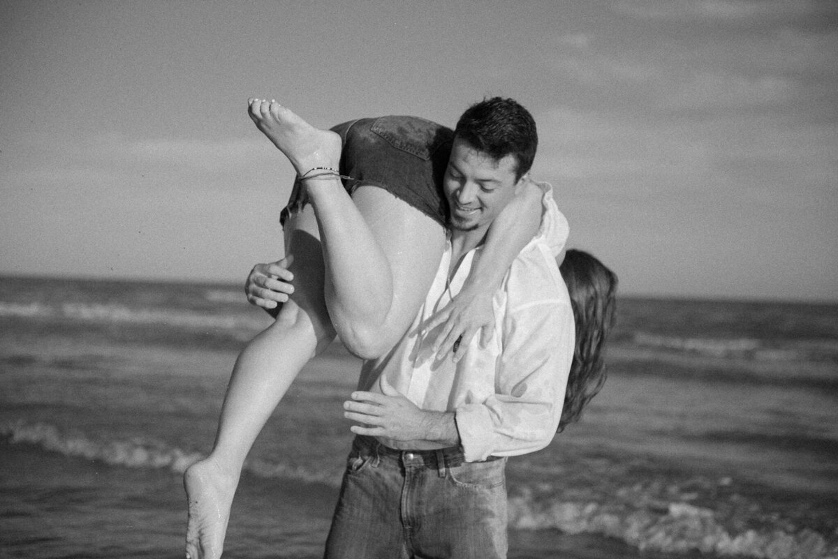 Black and white couple photography in black and white on Galveston beach Texas