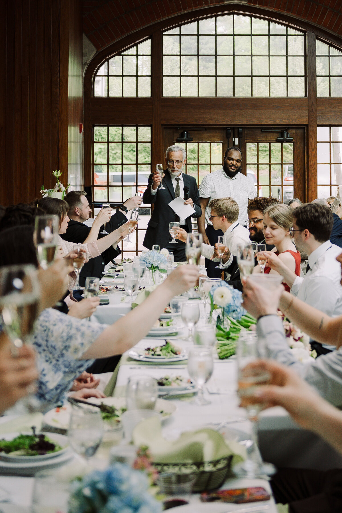 wedding guests toast at reception