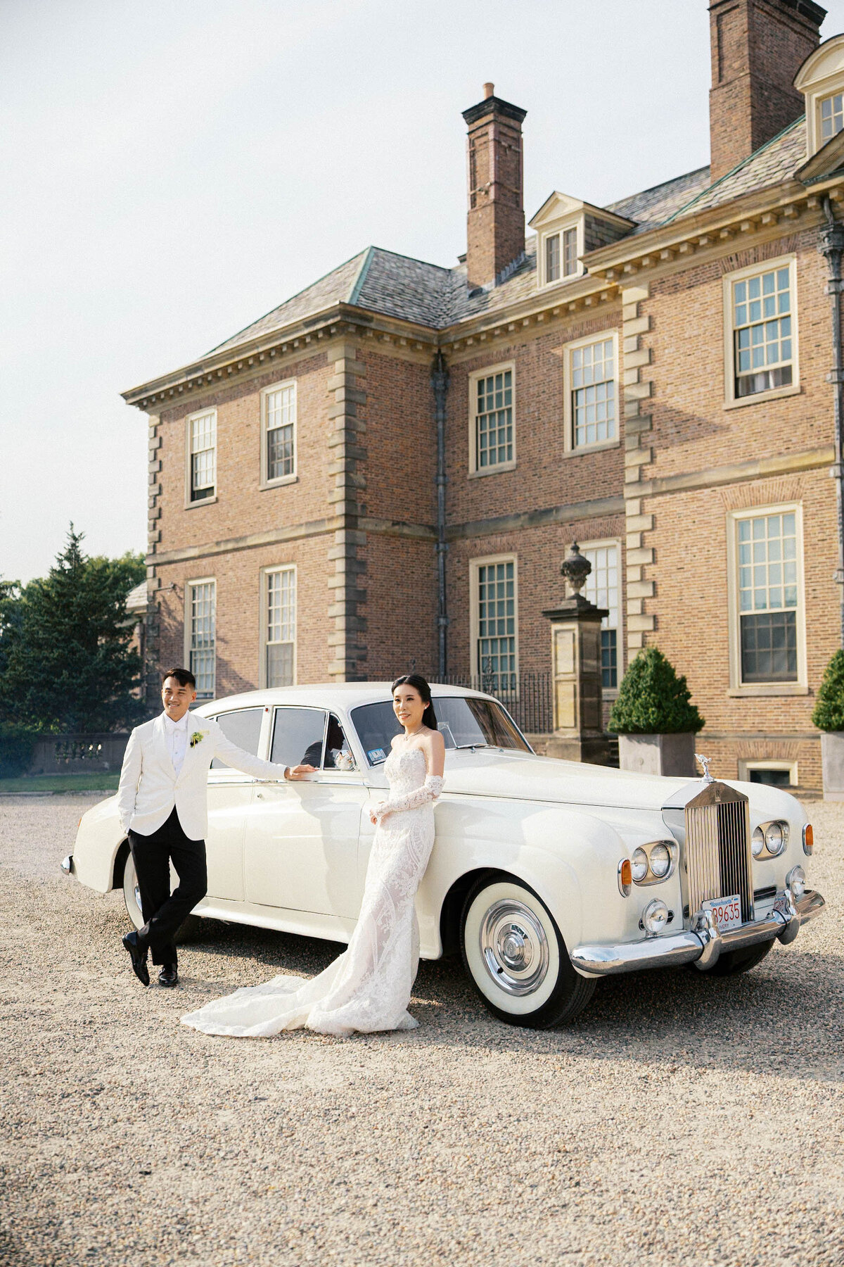 bride and groom standing in front of rolls royce at crane estate taken by boston documentary wedding photographer