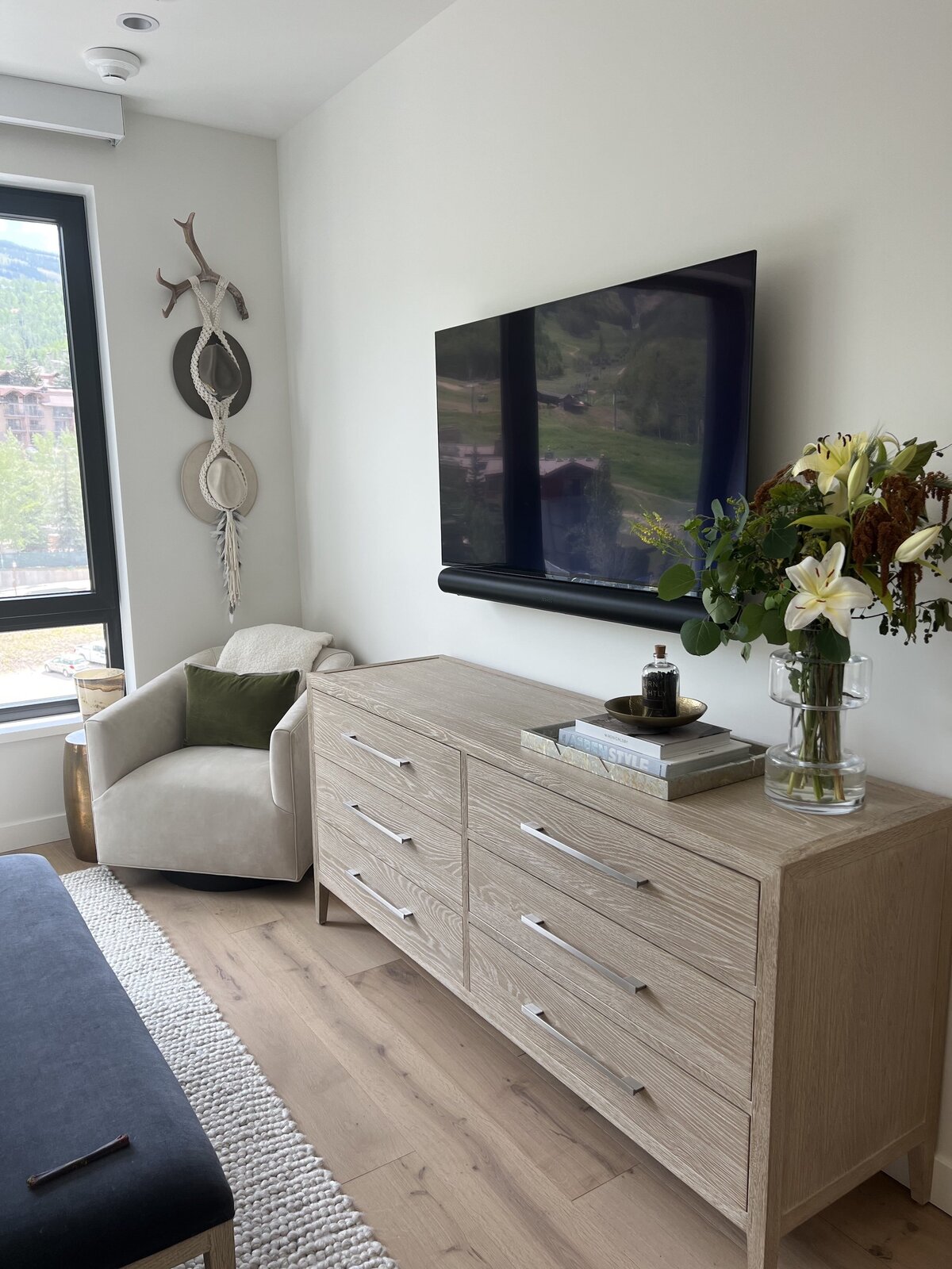 bedroom design with TV above dresser