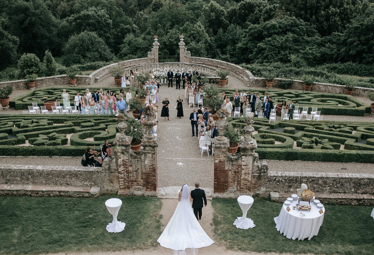 Father walking Bride down Aisle in Castle Wddding