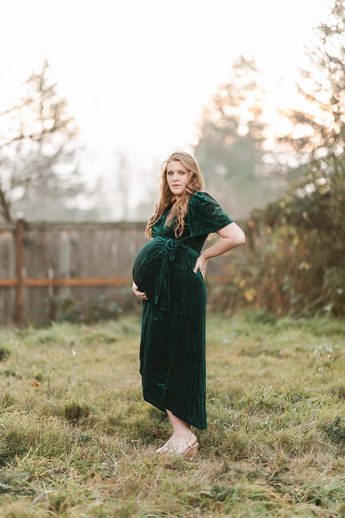 Expectant mother looking at the camera during her maternity photo session.