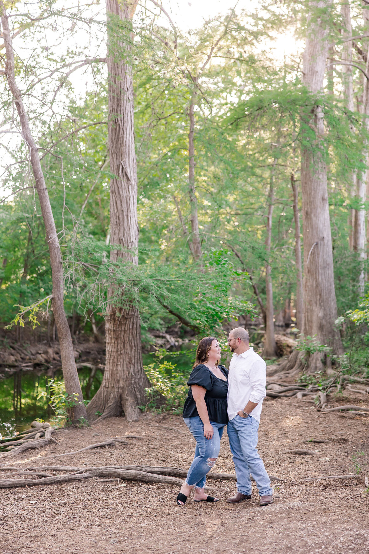 wedding engagement session among cypress trees in boerne Texas by photographer Firefly
