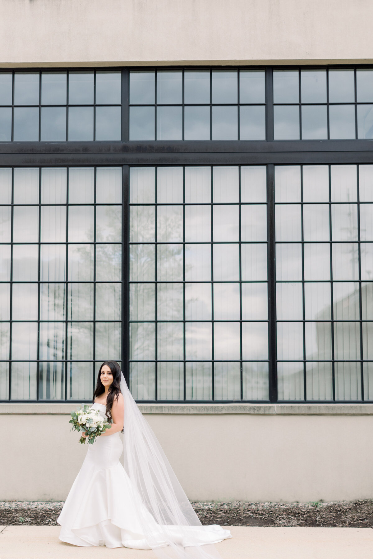 bride smiling holding a bouquet