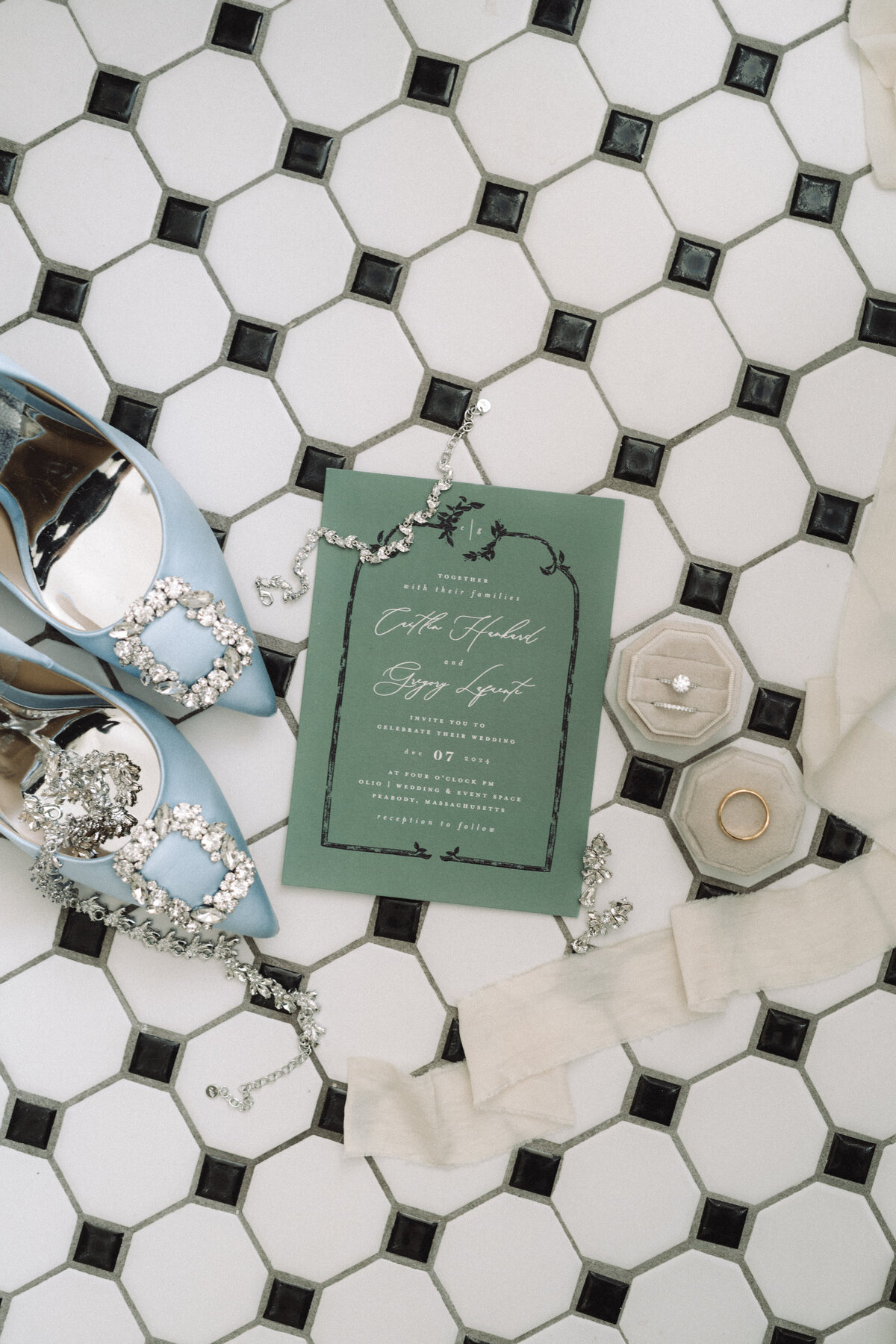 A wedding flatlay with a checkered background
