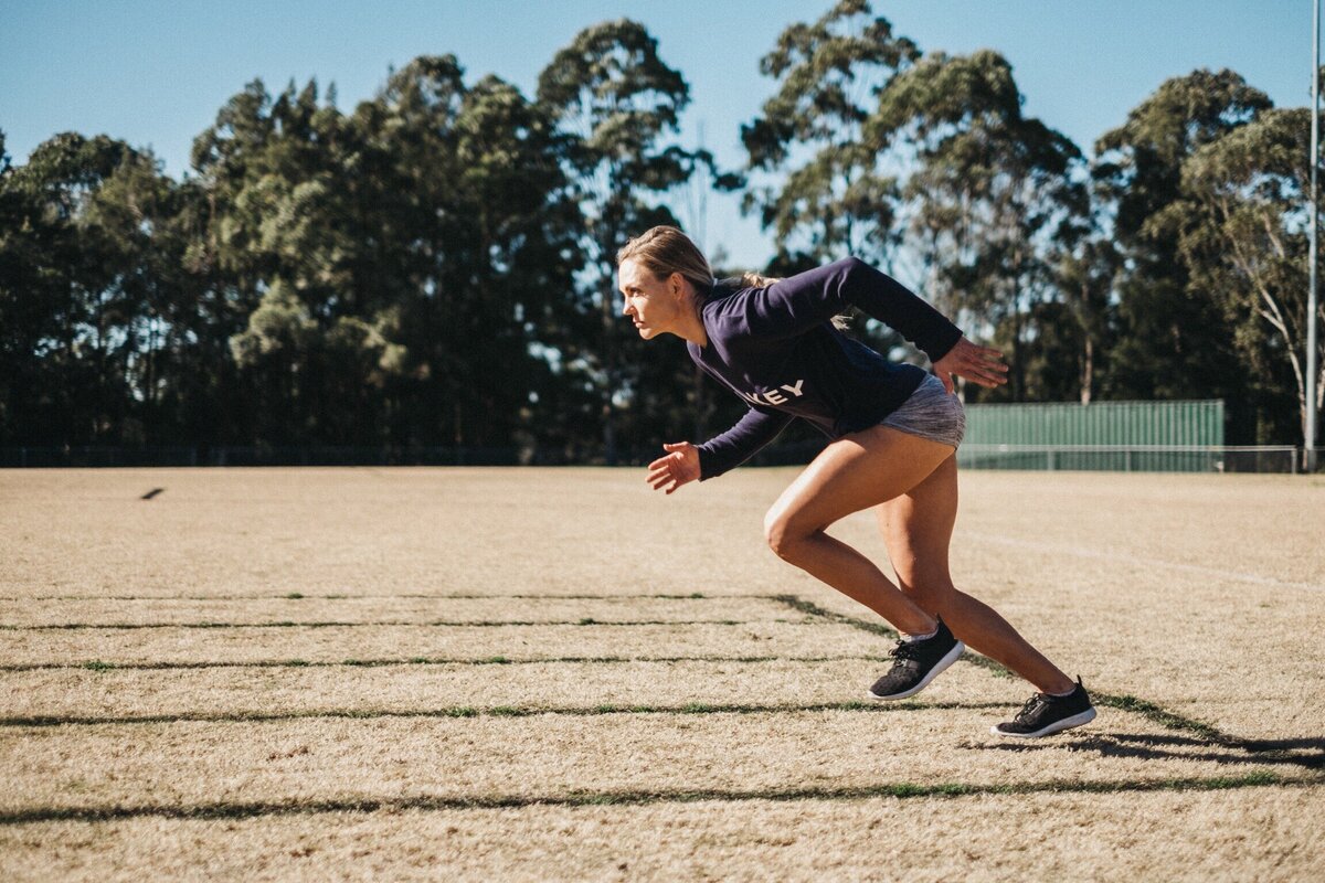 Libby Wescombe sprinting on a field