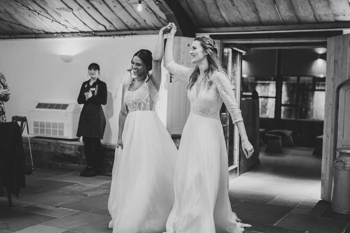 The girls walking into their wedding breakfast