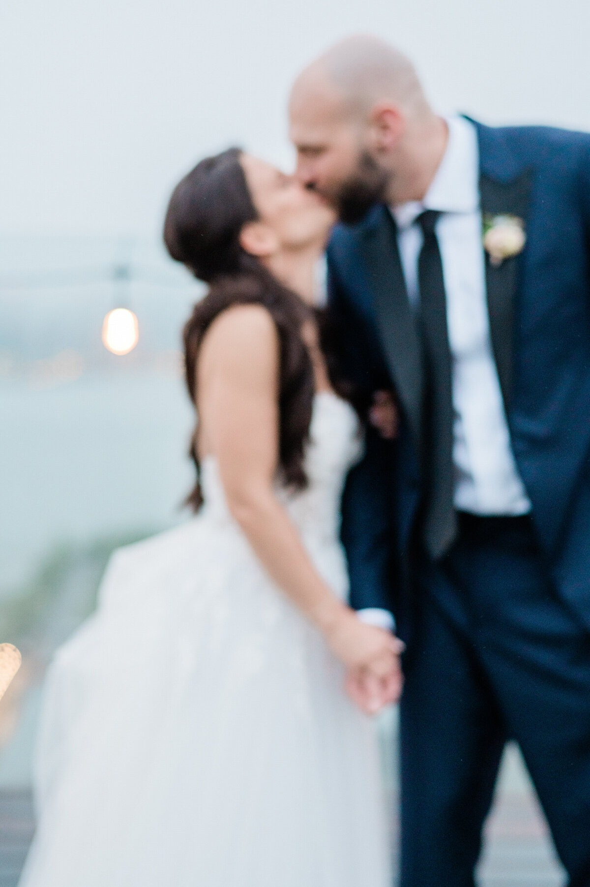 Newlyweds kiss on William Vale rooftop