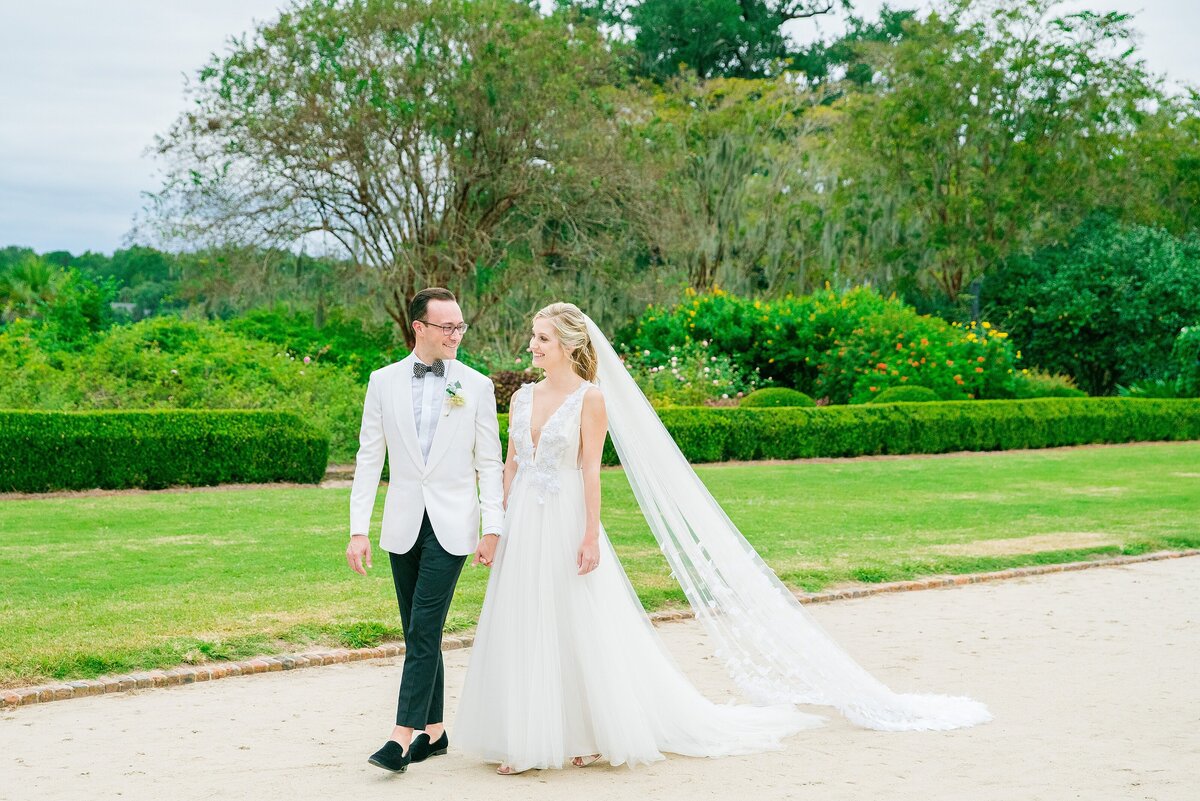 couple walking together at their boone hall wedding