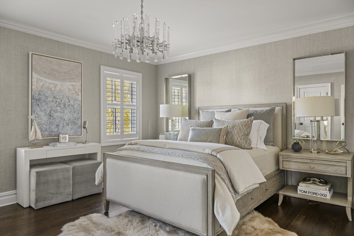 candra lynn interiors ocean port project bedroom with neutral colors and chandelier