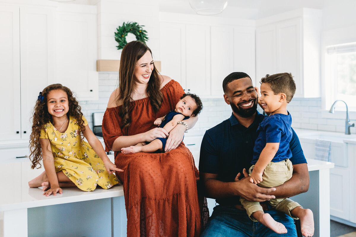 bi racial family of five in a white kitchen