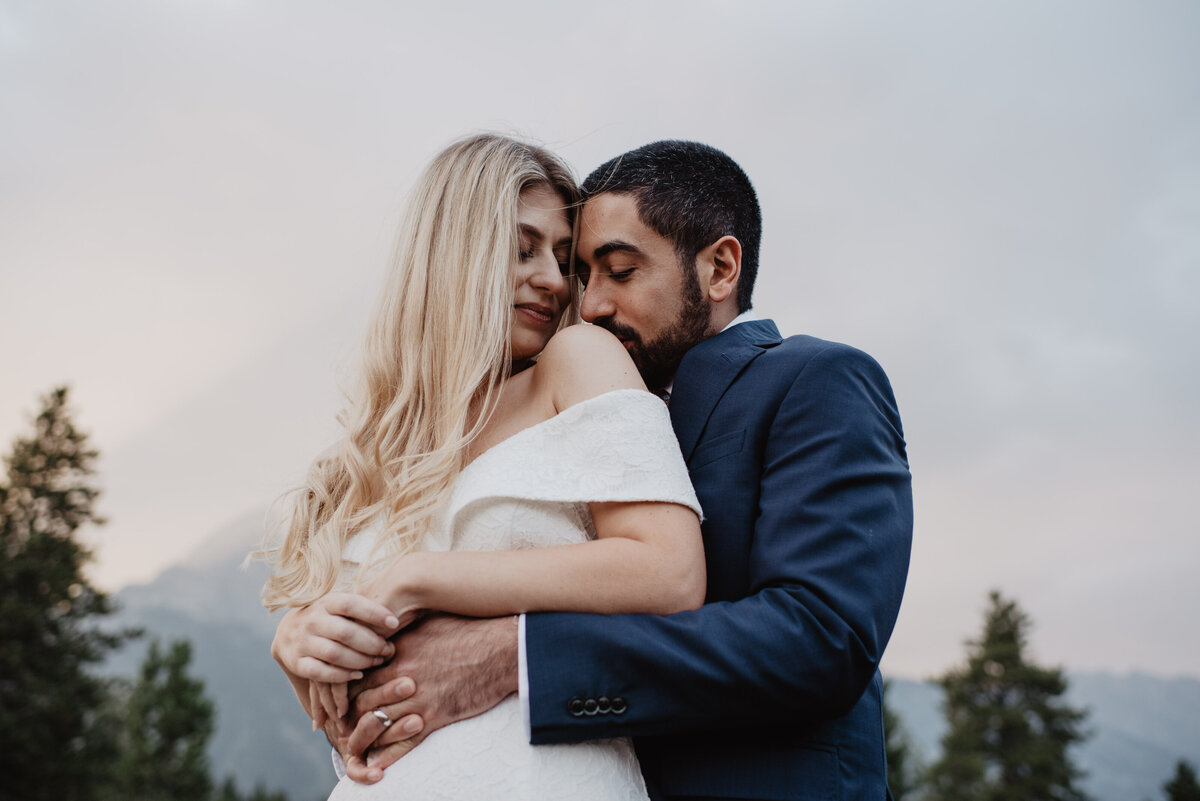 Photographers Jackson Hole capture bride and groom hugging during National Park wedding photos