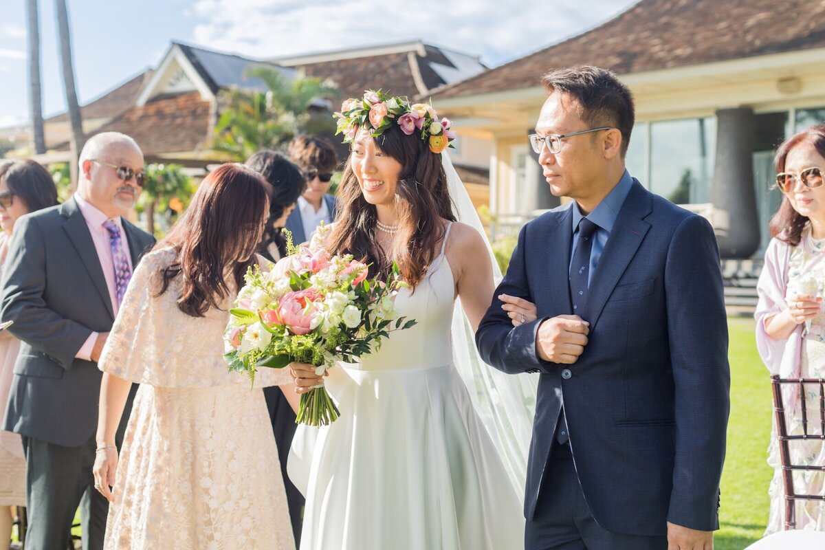 Wedding Photography of bride being walked down the isle in Maui, Hawaii