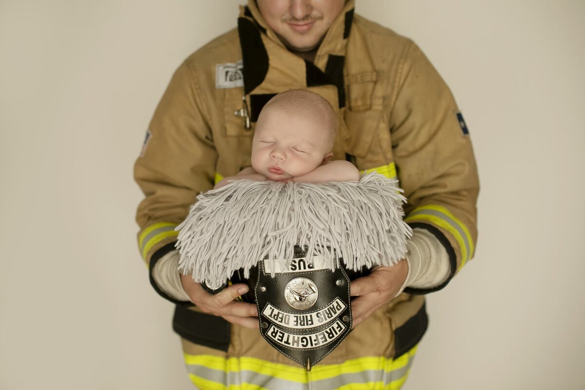 Firefighter and newborn with Chunky Monkey Photography