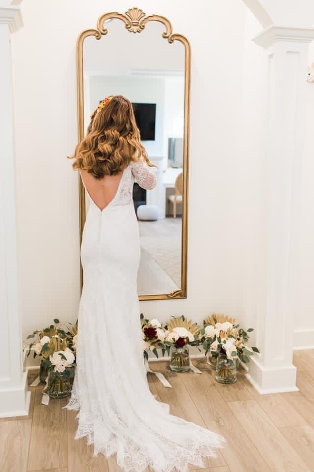 Lynchburg Virginia bride stands in front of mirror