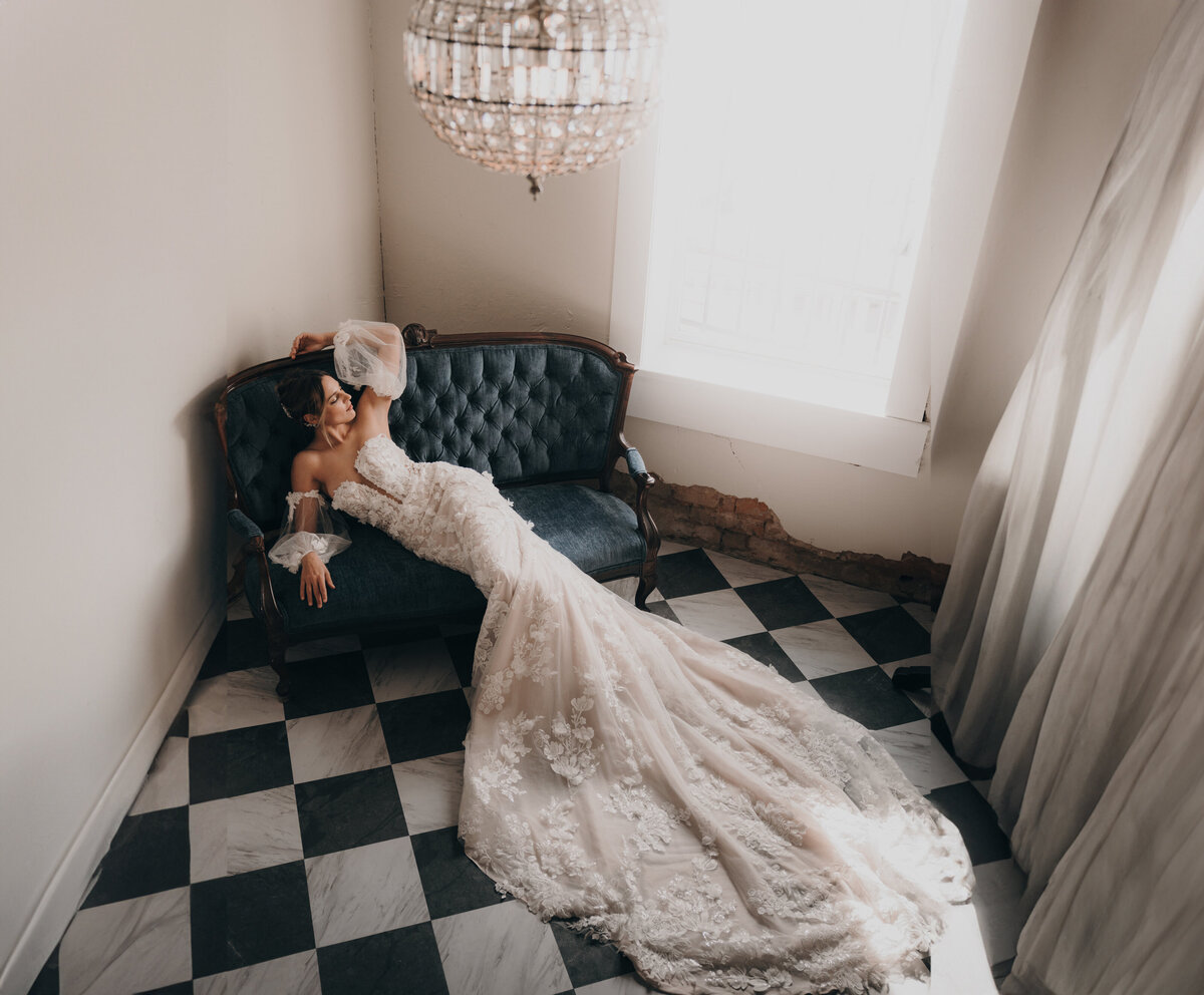 a bride on a vintage couch at Dallas Historic Jail.