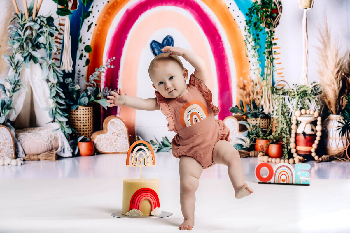 Cute one year old girl dances in Prescott kids photography session by Melissa Byrne