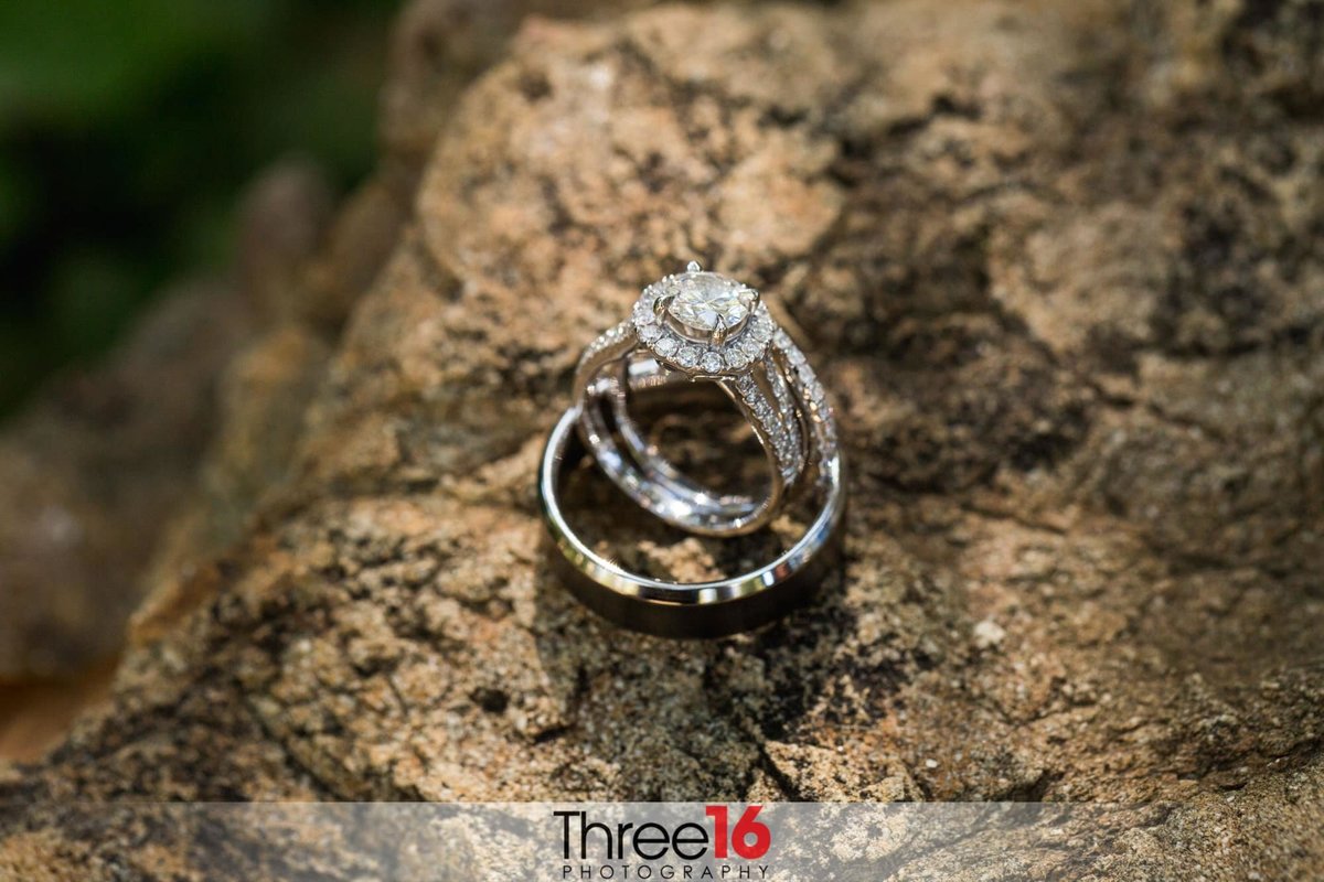 Bride's engagement ring sits inside her Groom's wedding band