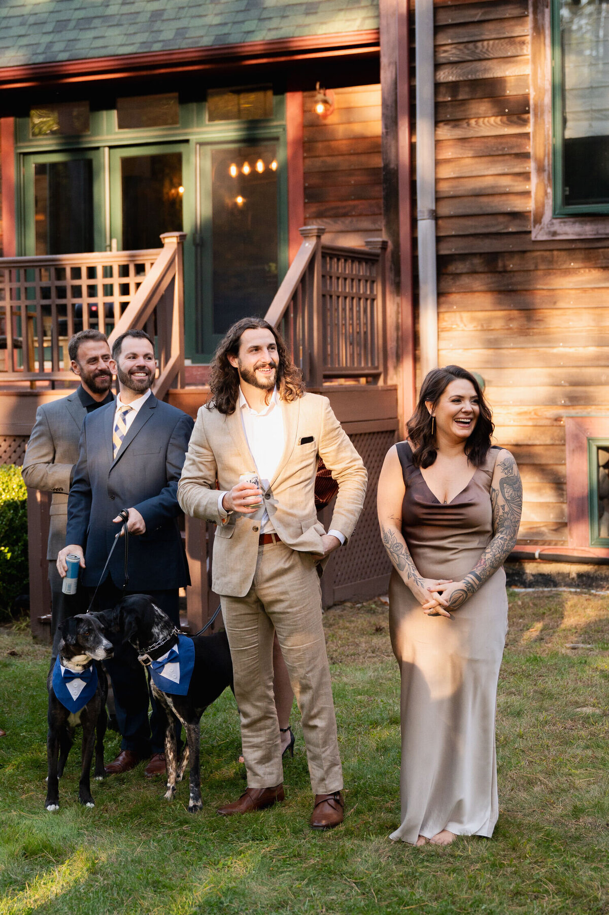 Candid guest reactions during an Adirondack Mountain backyard wedding at the Sagamore Golf House.