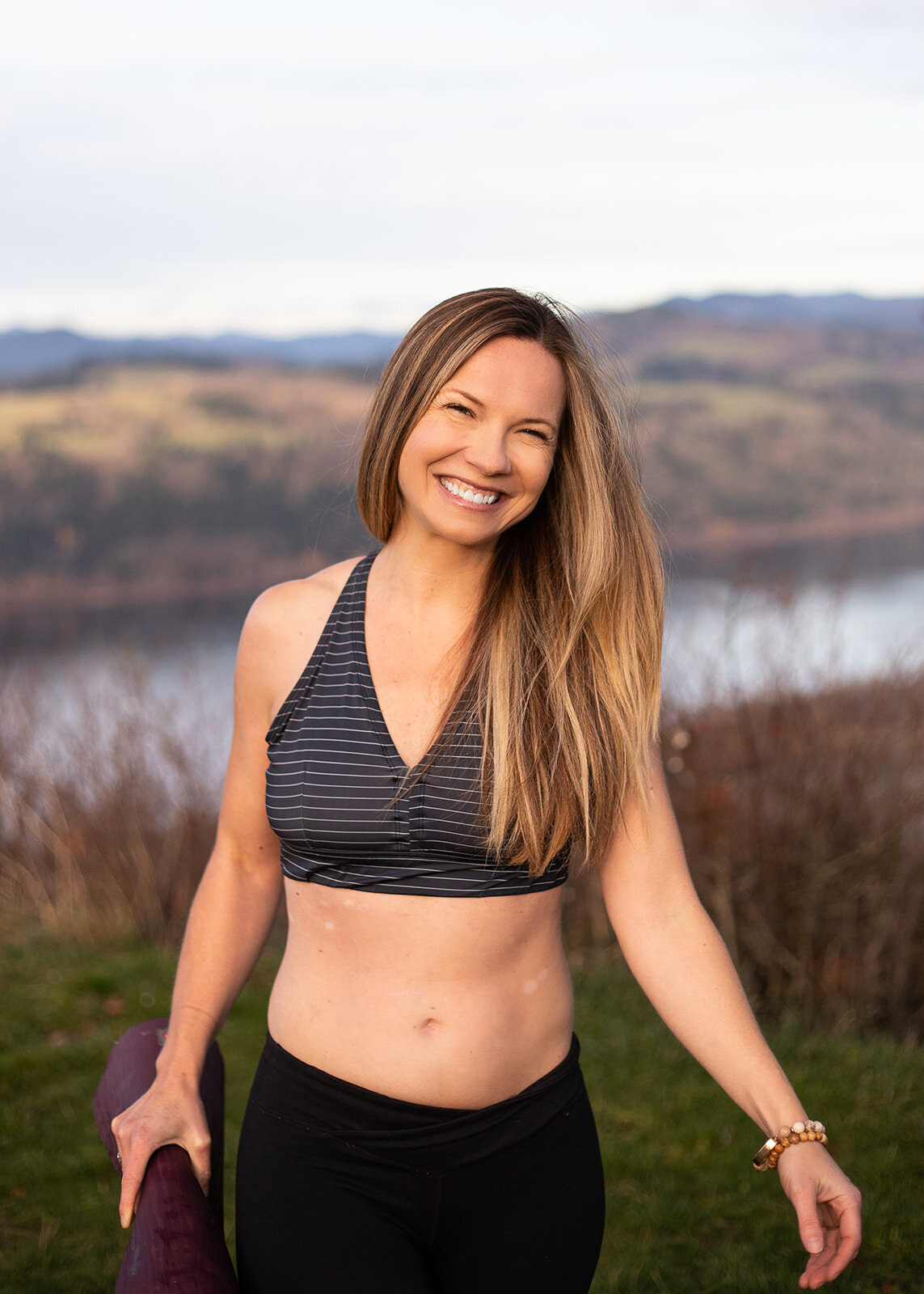 Yoga instructor walks towards camera during photoshoot in the Gorge. 