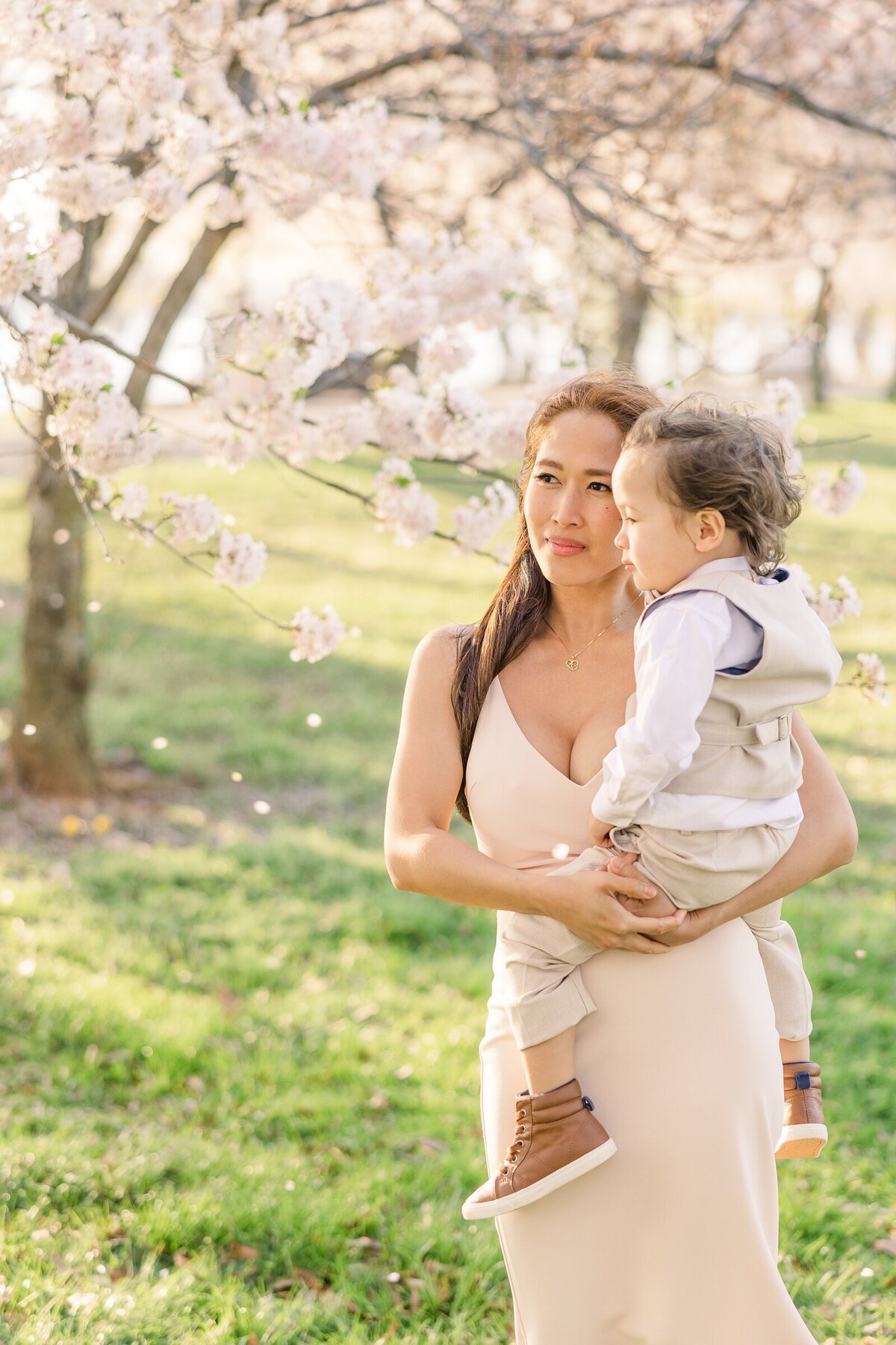 Mom holding her toddler boy by an Ohio family photographer