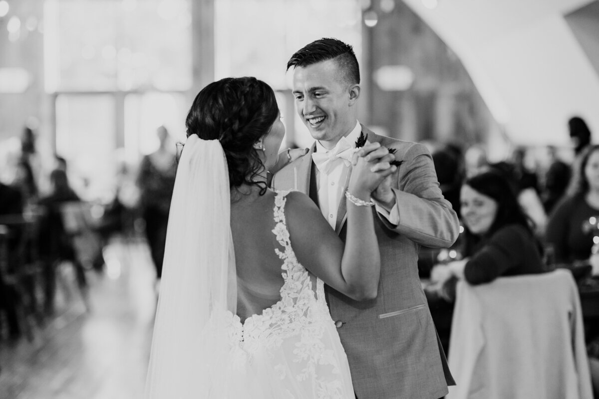 black and white photo of a bride and groom dancing at their reception
