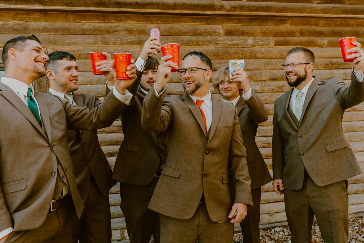 storyteller-collective-photo-co-groomsmen-toast-celebration-iowa