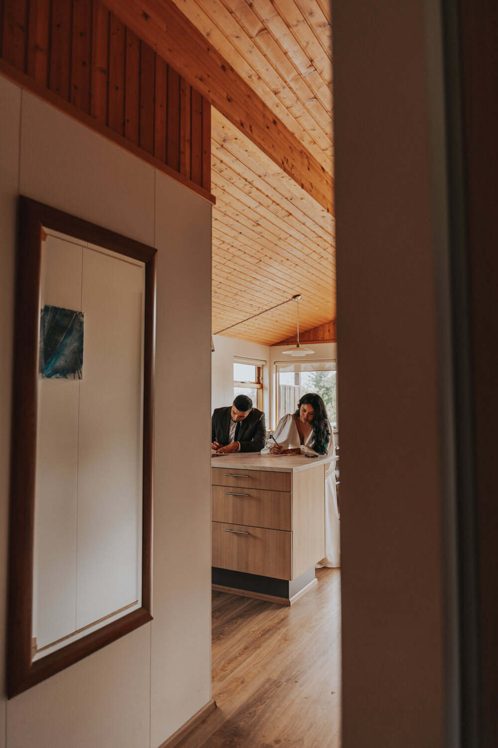 Husband and wife write vows at the bar 
