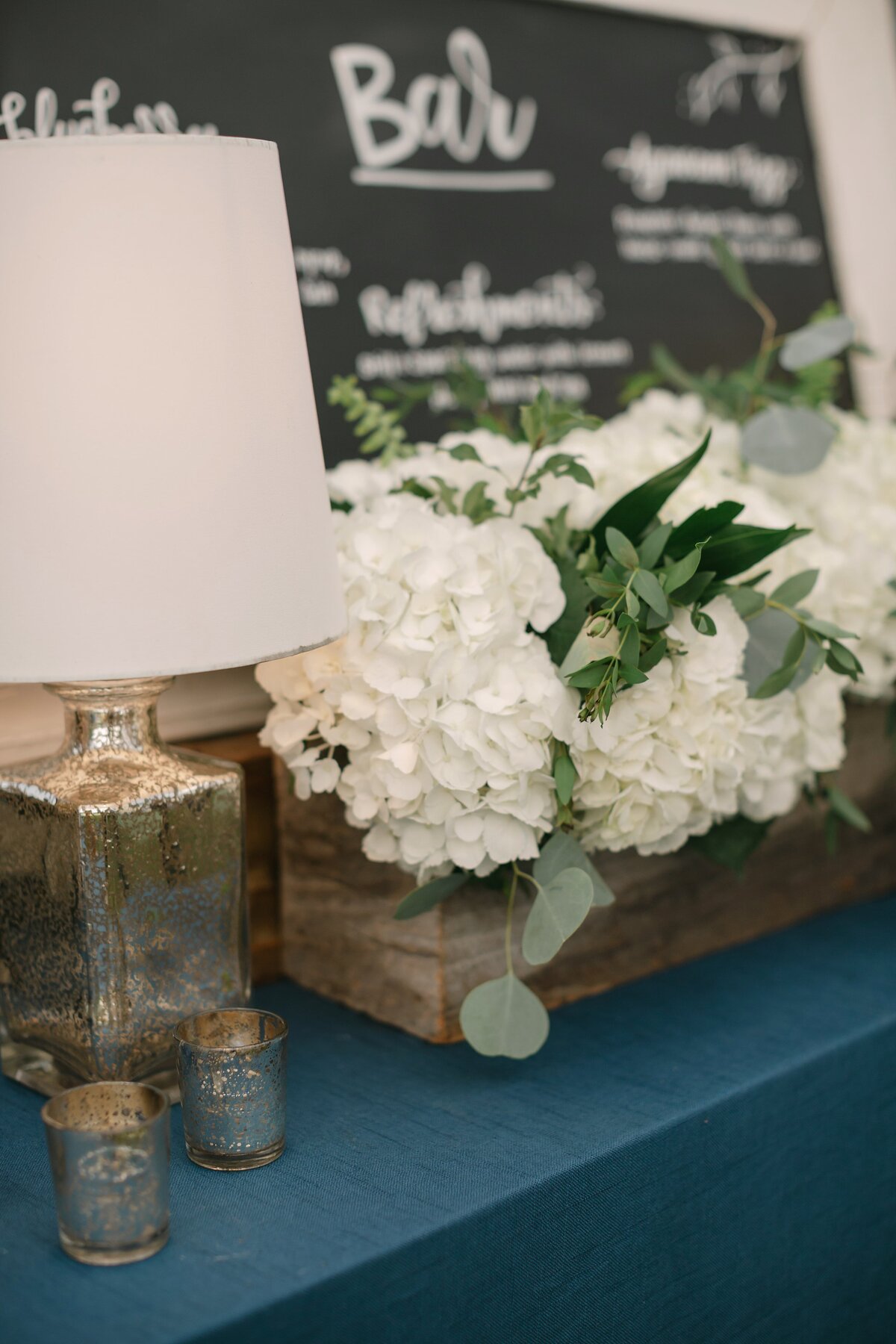 Bar wedding decor with bar sign.