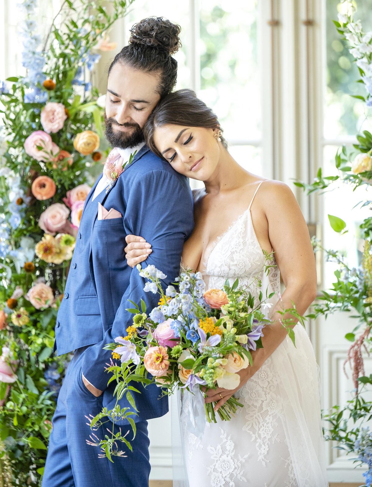Bride and groom with floral installation