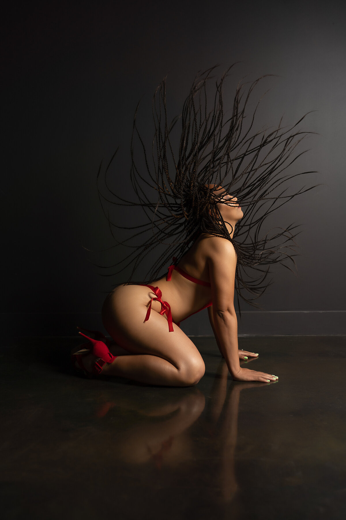 boudoir photo of woman flipping hair