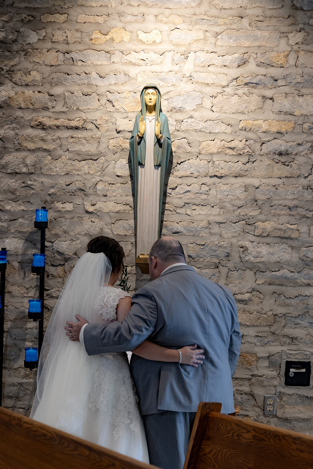 bride-and-groom-honor-mary-during-mass