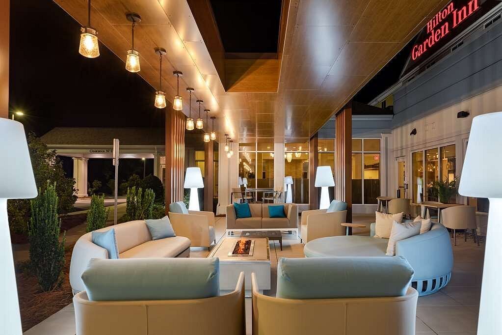 Hotel patio with outdoor furniture and turquoise accents