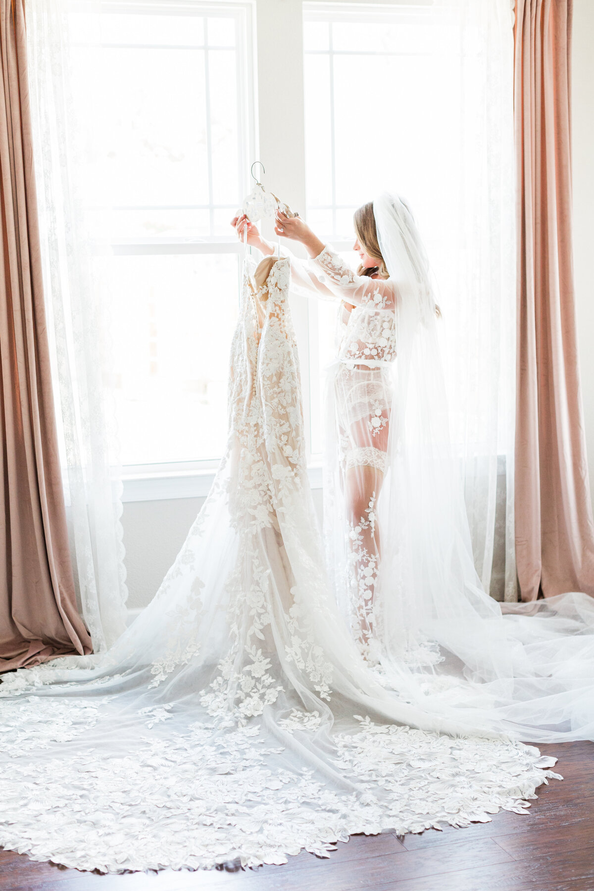 bridal boudoir looking at gown