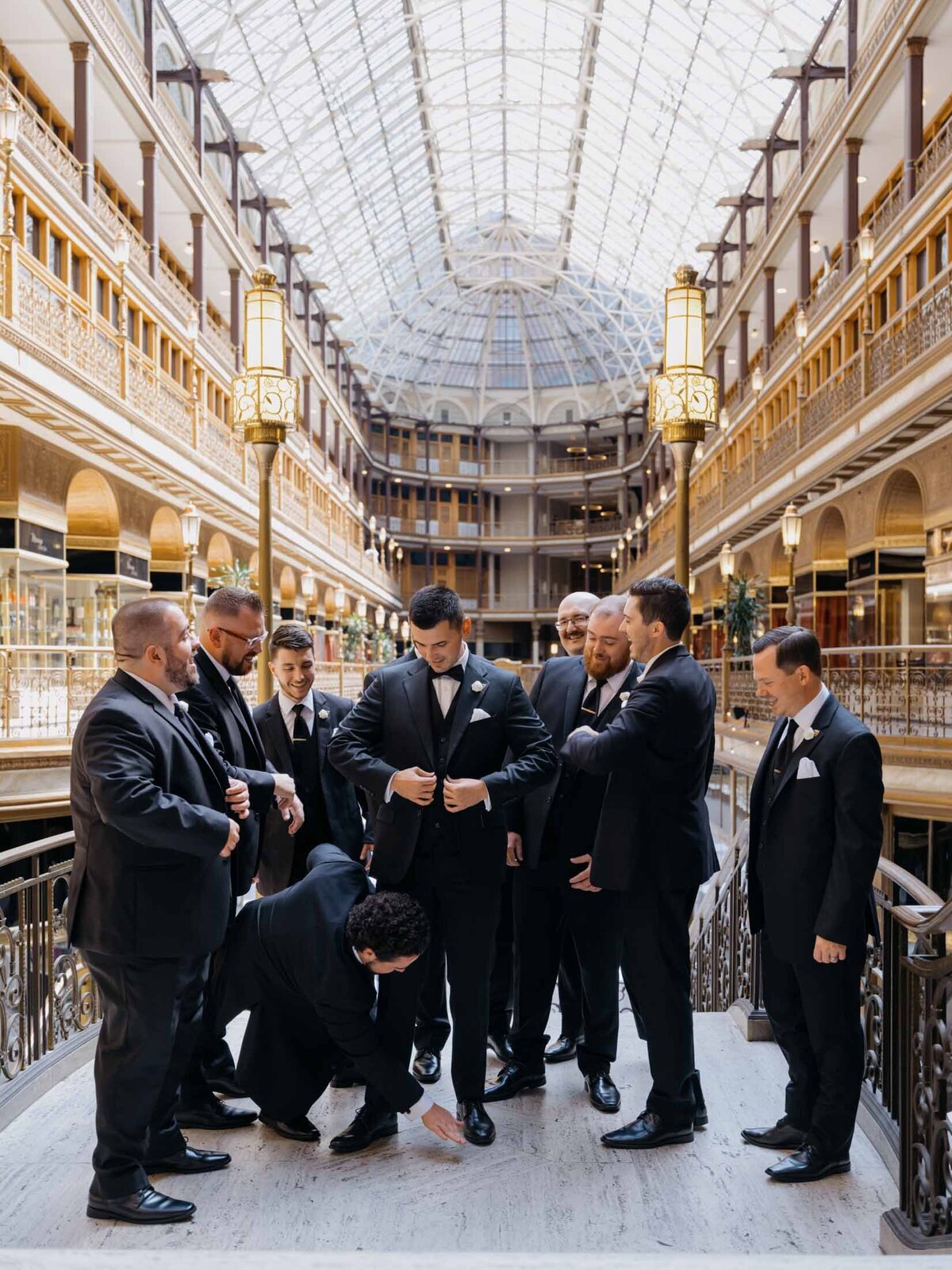 Modern wedding portraits of the groom inside The Arcade in downtown Cleveland