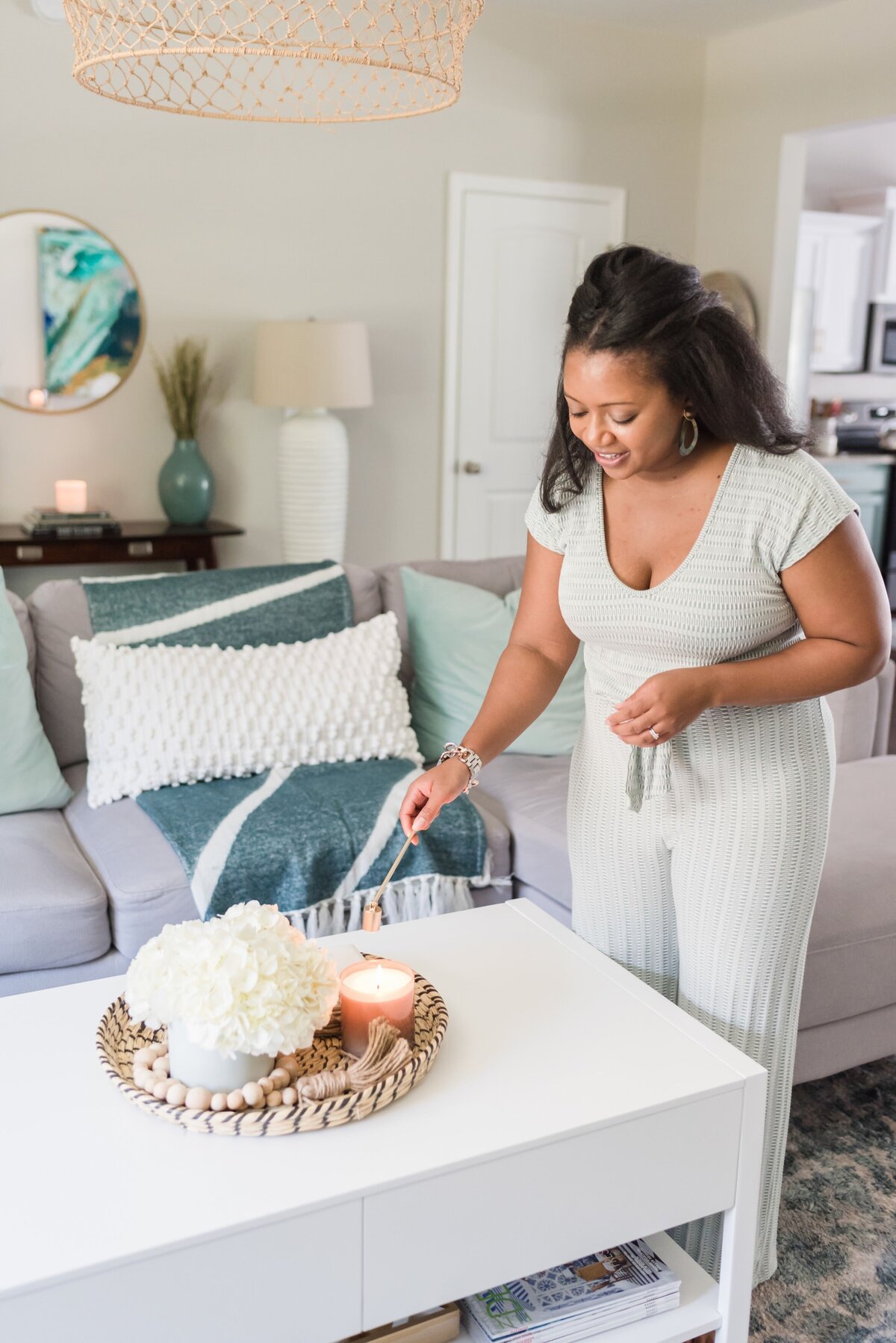 Interior designer in Murfreesboro about to snuff a candle in her living room