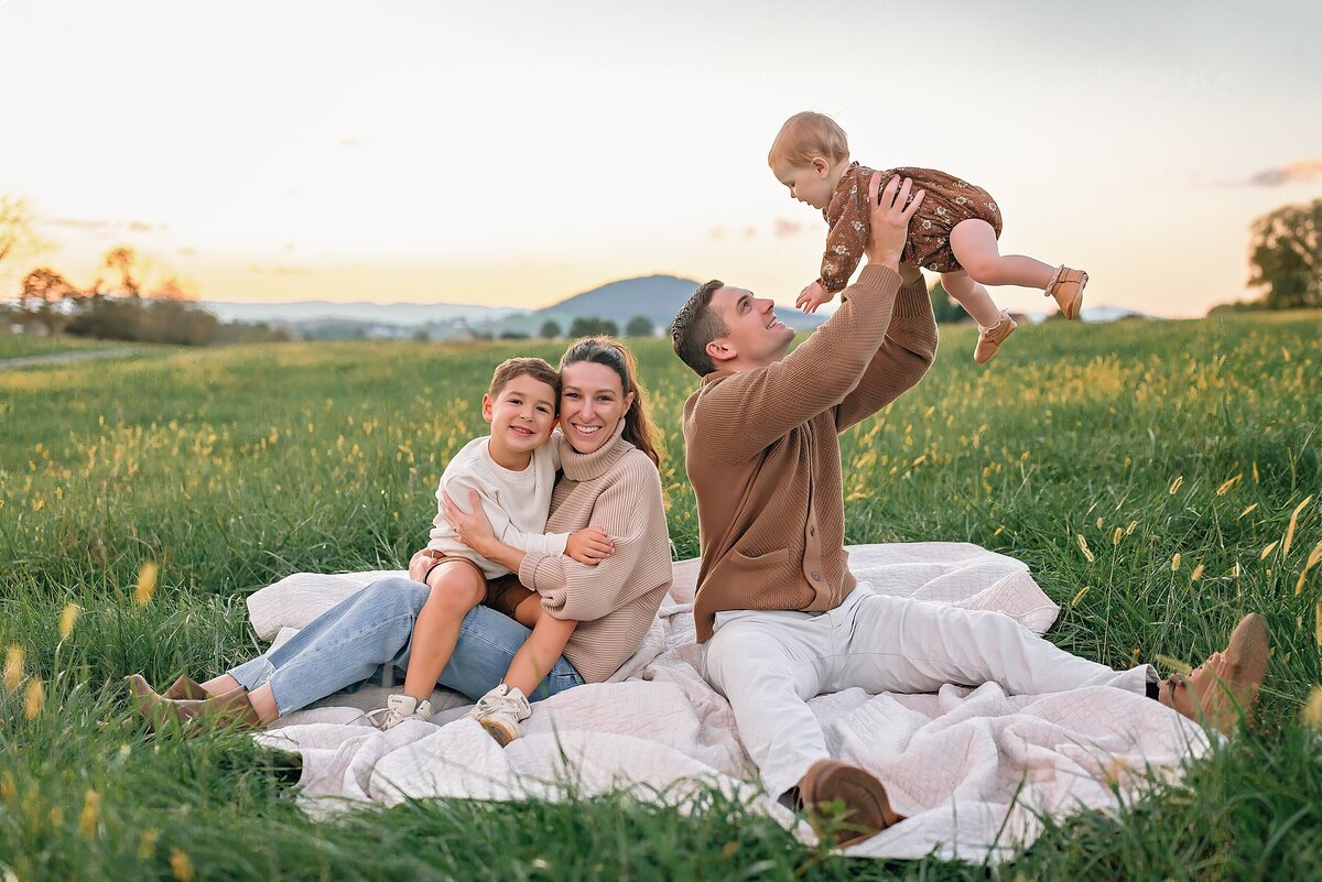 Family having fun in a field in Harrisonburg VA