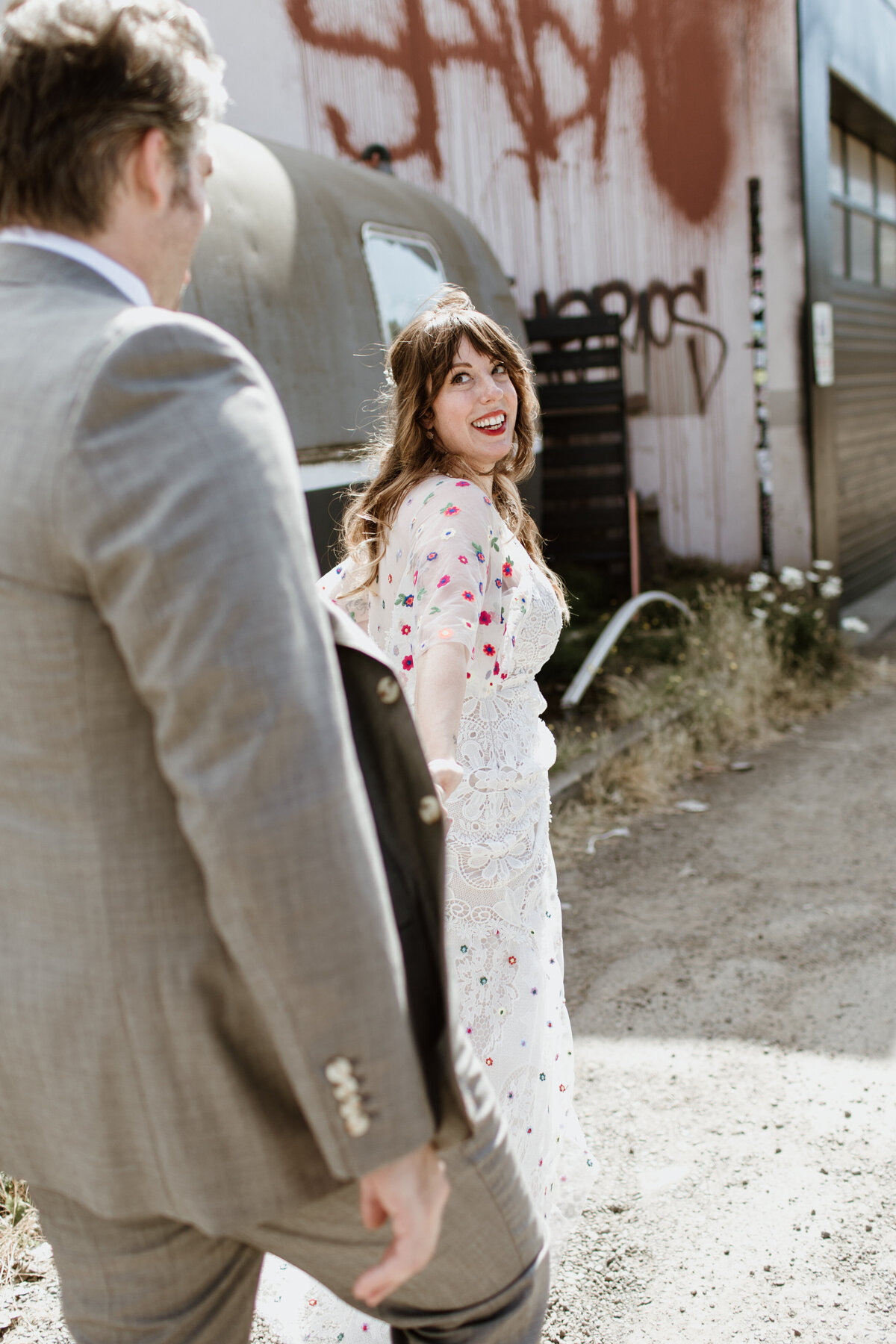 A unique offbeat bride and groom walking through urban Seattle captured by Fort Worth wedding photographer, Megan Christine Studio