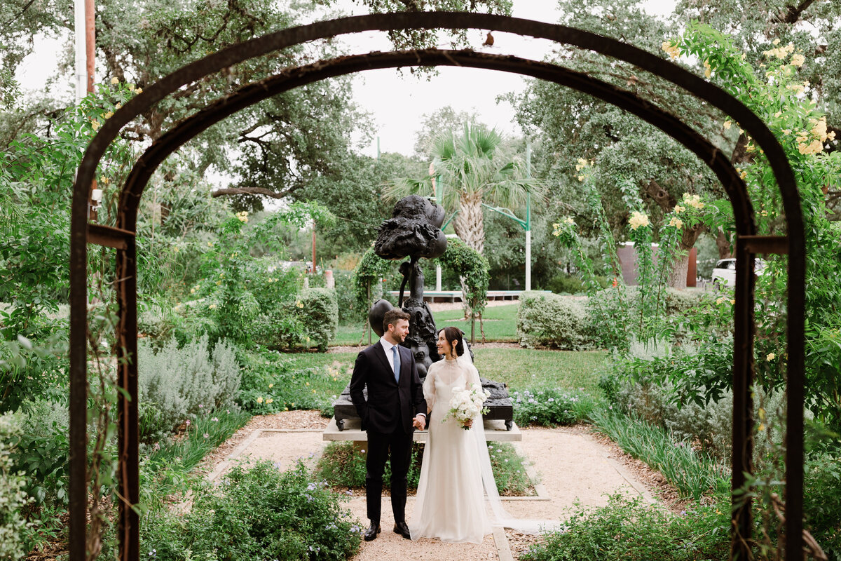 Bride and groom in the gardens at Laguna Gloria, Austin