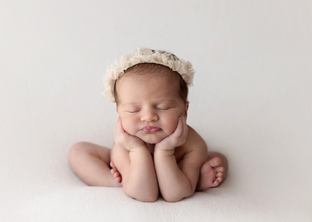 NEWBORN_BABYGIRLINWHITEWITHHEADBANDFROGGYPOSE