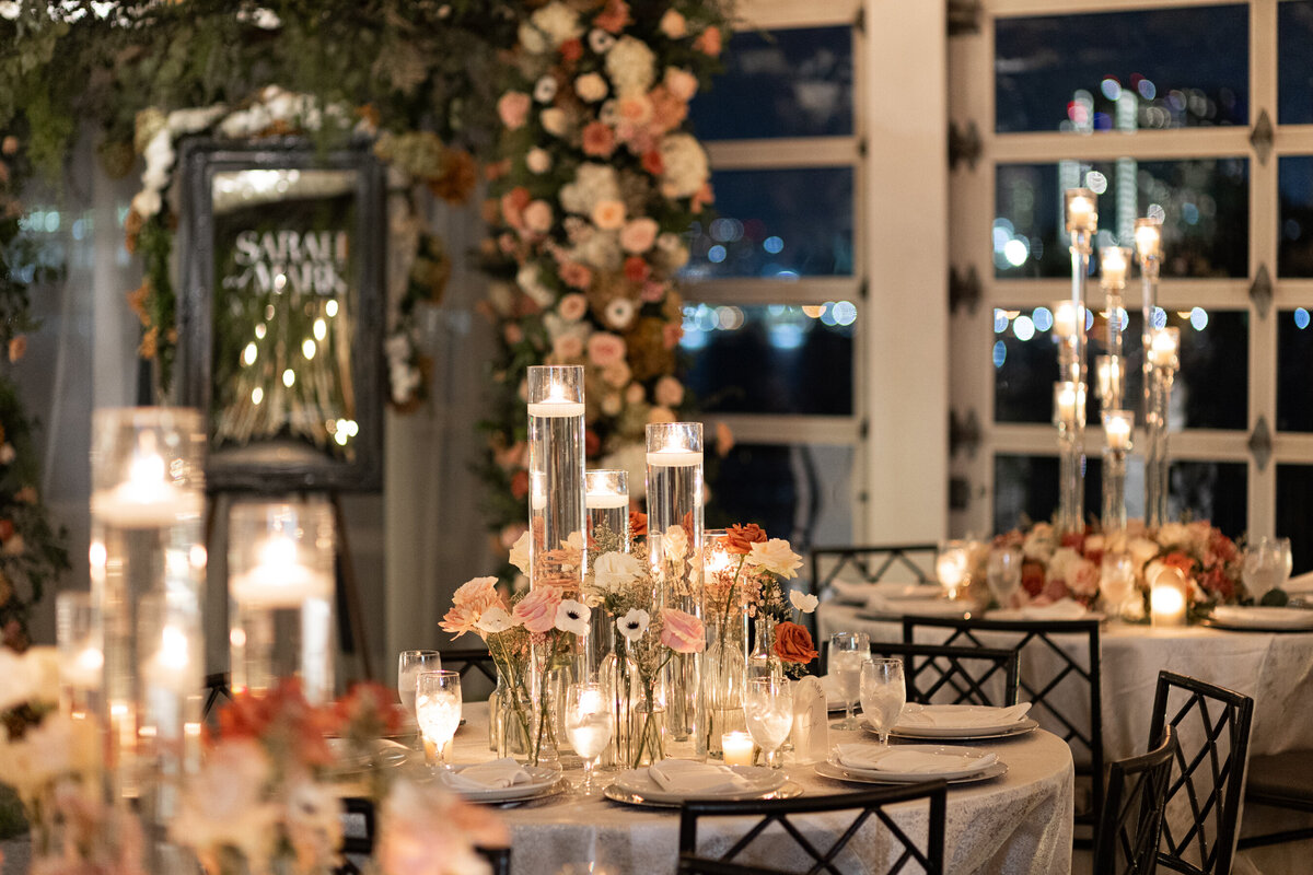 a candlelit shot of the tablescape at the wedding reception