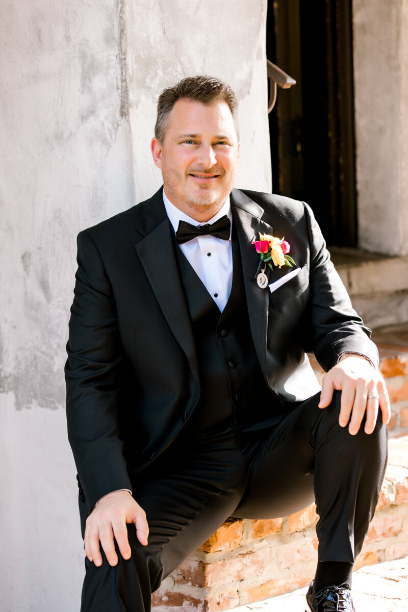 groom on steps at casa feliz wedding day