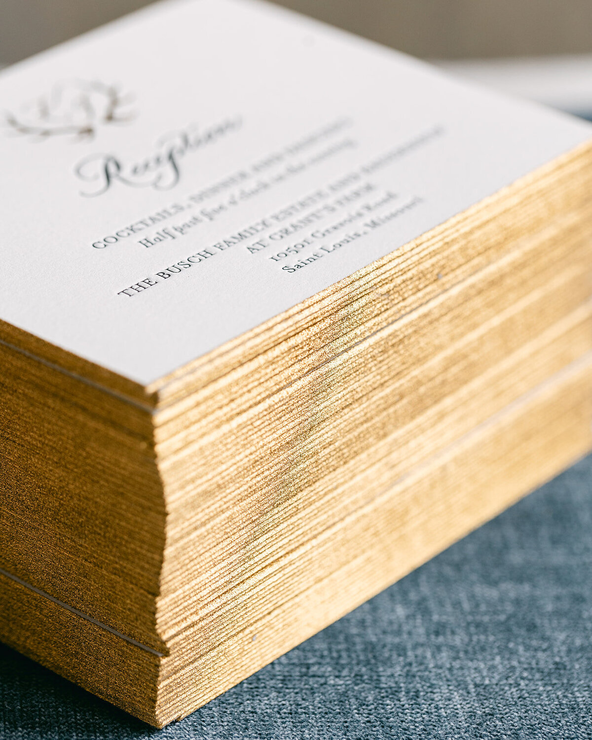 Gold foil edging on black and gold foil letterpress reception card