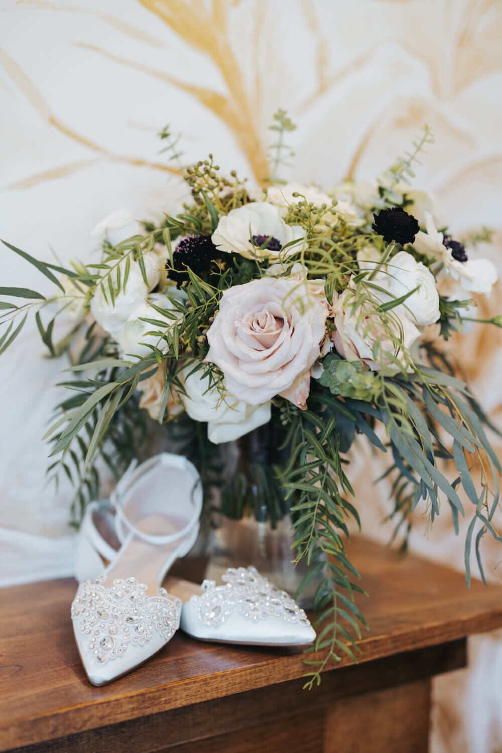 Shannan and Alex Wedding - bouquet next to bride shoes