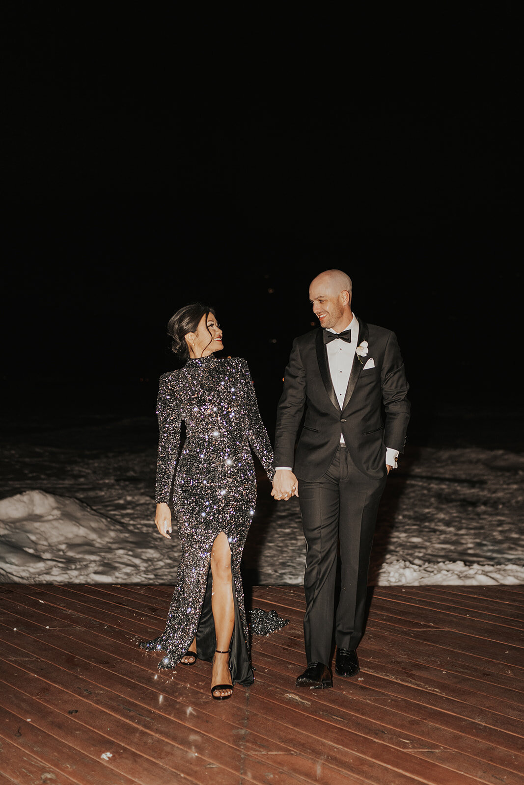 Bride and groom in their after party outfits at their wedding in Evergreen Colorado.